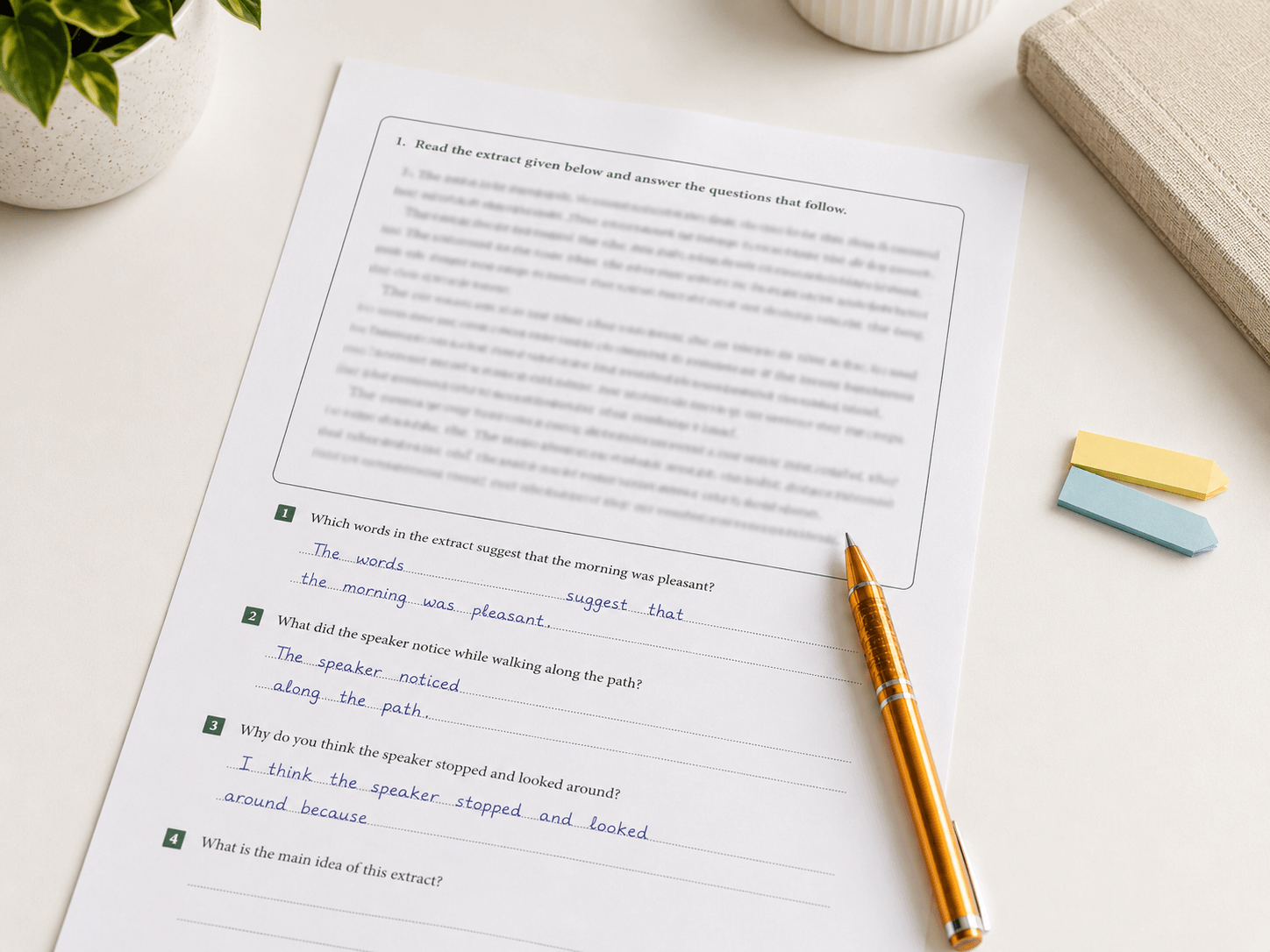 A printed practice worksheet with a reading extract and hand-written answers